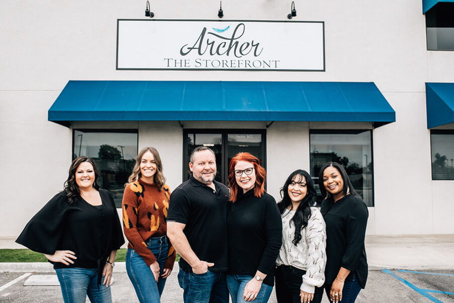 Archer the Storefront Rowe Stands with Small